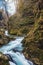 Beautiful waterfall and wooden pathway in Vintgar gorge