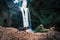 Beautiful waterfalls called - Ouzoud in Morocco. Ouzoud Falls in Africa. Landscape photo with small cat.