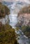 Beautiful waterfalls at dusk in early autumn, portrait