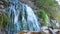 Beautiful waterfalls falling down. Slavonic springs, Izborsk.