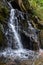 The beautiful waterfalls, rapids and mountain streams in the tropical forest in Yanoda Park,  Sanya city. Hainan, China