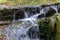 The beautiful waterfalls, rapids and mountain streams in the tropical forest in Yanoda Park,  Sanya city. Hainan, China