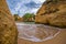 Beautiful wave in famous rock formation in a bay on the beach of Tres Irmaos in Alvor, PortimÃ£o, Algarve, Portugal, Europe.