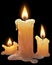 Beautiful wax candles burning on a dark background.