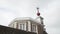 Beautiful weathervane with arrow on the house roof against the cloudy sky. Action. Close-up