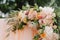 Beautiful wedding archway. Arch decorated with peachy cloth and flowers