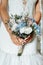 Beautiful wedding bouquet in bride`s hands. Bride`s flowers