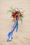 Beautiful wedding bouquet in the desert sand
