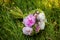 Beautiful wedding bouquet of flowers and greenery and blur background, selective focus. Amazing happy sunny day