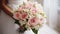 Beautiful wedding bouquet in hands of the bride. Bouquet of rose flowers, close up