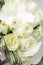 Beautiful wedding bouquet of roses and orchids and two gold and platinum wedding rings
