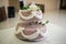 Beautiful wedding cake bride and groom cut into pieces