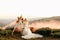 Beautiful wedding ceremony in the mountains, wedding couple of newlyweds in love hug