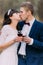 Beautiful wedding couple drinking wine, celebrating their marriage