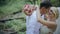 Beautiful wedding couple kissing in a forest