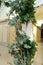 Beautiful wedding huppah decorated with fresh fresh flowers from hydrangea and eucalyptus sheets in a large beautiful wedding hall