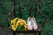 Beautiful wedding shoes with high heels and a bouquet of sunflowers on a vintage chair