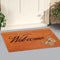 Beautiful welcome peach color coir doormat with Butterfly Placed outside
