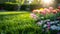 Beautiful well-kept spring garden. The green lawn emphasizes the full bloom of flowers in the mixborder. Diverse floral