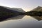 Beautiful Welsh Mountains reflected in a still waters of lake Llyn Padarn, Llan Beris Wales