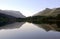 Beautiful Welsh Mountains reflected in a still waters of lake Llyn Padarn, Llan Beris Wales