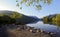 Beautiful Welsh Mountains reflected in a still waters of lake Llyn Padarn at Lone Tree Llan Beris Wales