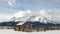 Beautiful Western scene with wood corral and winter Sawtooth Mountains backdrop