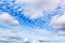Beautiful whimsical Altocumulus clouds. The center looks like a