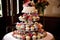 beautiful and whimsical cupcake display on round cake stand
