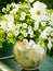 A beautiful white bouquet of flowers  of a wild garden in an old crockery jar