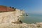 Beautiful white chalk cliff stack Seaford East Sussex England UK near Seven Sisters tourist attraction with blue sea and sky
