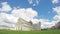 Beautiful white clouds flying above Pisa cathedral and leaning tower in Italy