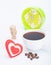 Beautiful white cup, coffee, hearts with an alarm clock on a white background