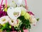 Beautiful white Eustoma Gypsophila flowers bouquet in pink pastel basket dark background. Floral gift blooming wallpaper