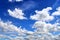 Beautiful white fluffy cloud formations on a blue sky taken in spring