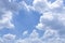 Beautiful white fluffy clouds on vivid blue sky in a sunny day upward photo and copy space