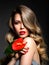 Beautiful white girl with red  flowers. Stunning girl with  Anthurium red. Closeup face of young beautiful blonde woman with a