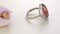 Beautiful White Gold Halo Red Oval Diamond Ring paved with stones