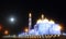 A beautiful white Islamic mosque or masjid in night view