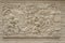 Beautiful white Java stucco patterned on the boundary wall. Vintage white wall bas-relief stucco in plaster, depicts Lotus flower