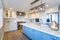 Beautiful white kitchen with large island.