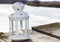 Beautiful white lantern at the wooden pier