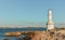 Beautiful white lighthouse on rock shore at Ibiza island, Formentera.