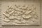 Beautiful white lotus stucco patterned on the boundary wall. Vintage white wall bas-relief stucco in plaster, depicts Lotus