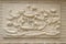 Beautiful white lotus stucco patterned on the boundary wall. Vintage white wall bas-relief stucco in plaster, depicts Lotus