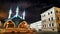 Beautiful white mosque with minarets against a dark cloudy sky in night or evening. Ramadan Holiday