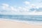 Beautiful white sand beach and ocean waves with clear blue sky