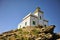 Beautiful white stone lighthouse on the rock