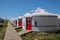 Beautiful white Yurts with pray flags and dray in Huanghuagou Huitengxile grassland near Hohhot, Inner Mongolia, China