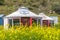 Beautiful white Yurts with pray flags and dray in Huanghuagou Huitengxile grassland near Hohhot, Inner Mongolia, China